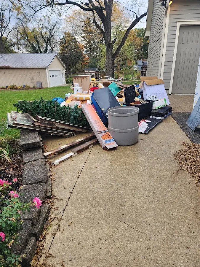 Dumpster being loaded with debris for Demolition Dumpster Rental in Port Neches